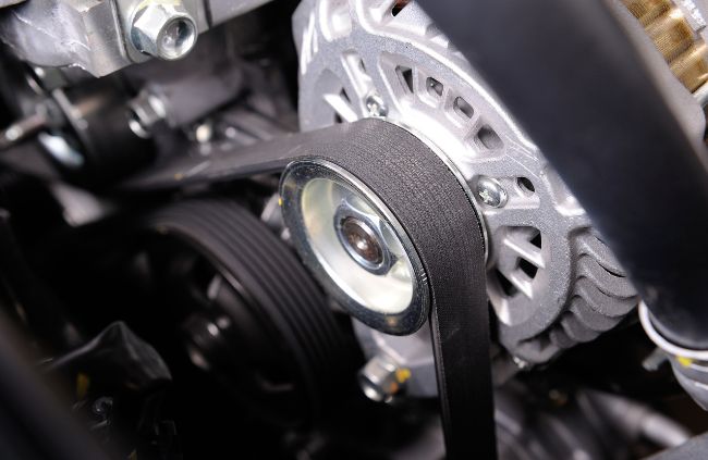 Close-up of a new drive belt fitted to a car engine, showcasing expert car belt replacement in Sydney. Close-up of a new drive belt fitted to a car engine, showcasing expert car belt replacement in Sydney.