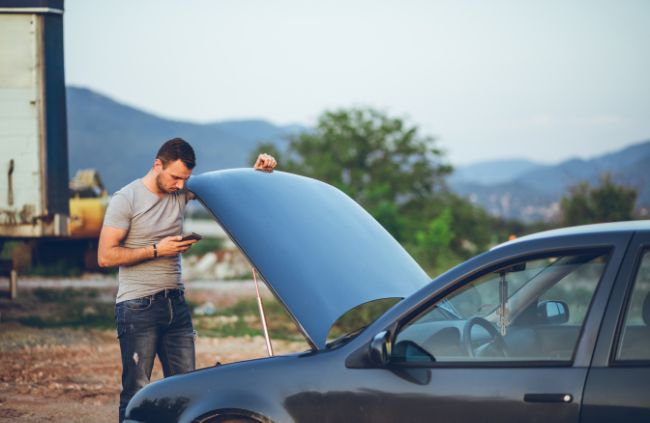 Man stranded with broken down car calling True Blue Mobile Mechanics for mobile car repair service in Sydney Man stranded with broken down car calling True Blue Mobile Mechanics for mobile car repair service in Sydney